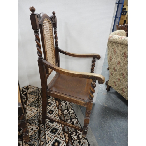 299 - Set of six oak dining chairs with bergère back rests, including a pair of carvers.  (6)