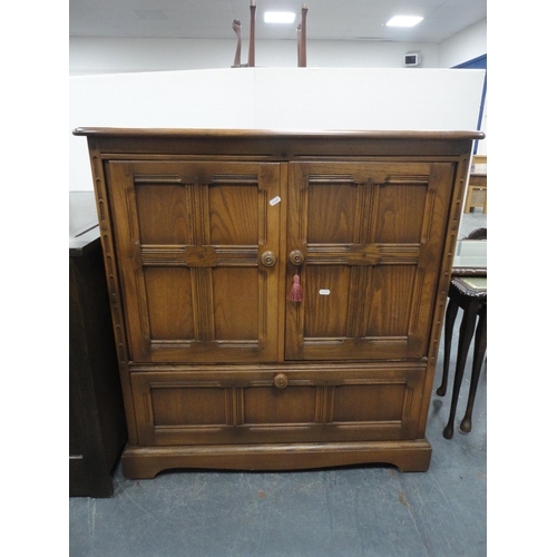 301 - Priory-style two-door cupboard, another Priory-style cupboard and an Ercol-style television cabinet.... 