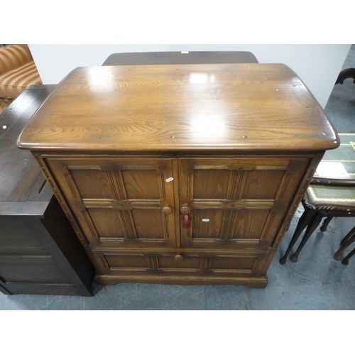 301 - Priory-style two-door cupboard, another Priory-style cupboard and an Ercol-style television cabinet.... 