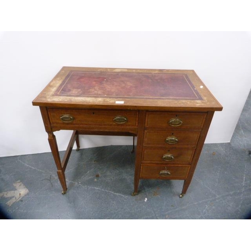 312 - Edwardian inlaid mahogany kneehole desk of small proportions, with tooled skiver to the top.