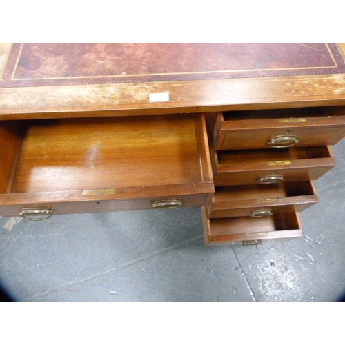312 - Edwardian inlaid mahogany kneehole desk of small proportions, with tooled skiver to the top.