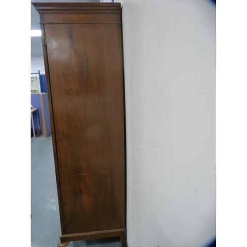 317 - Mahogany two-door wardrobe on pad feet.