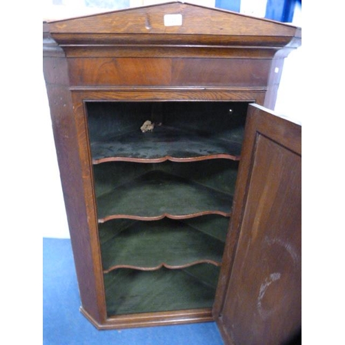 329 - Antique oak corner cupboard.