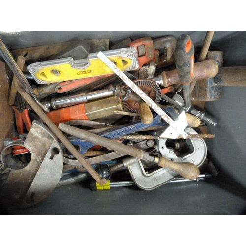 337 - Toolboxes and boxes containing a large quantity of tools to include pipe cutter, levels, hammers, sa... 