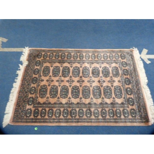 338 - Bokhara machine-made rug.