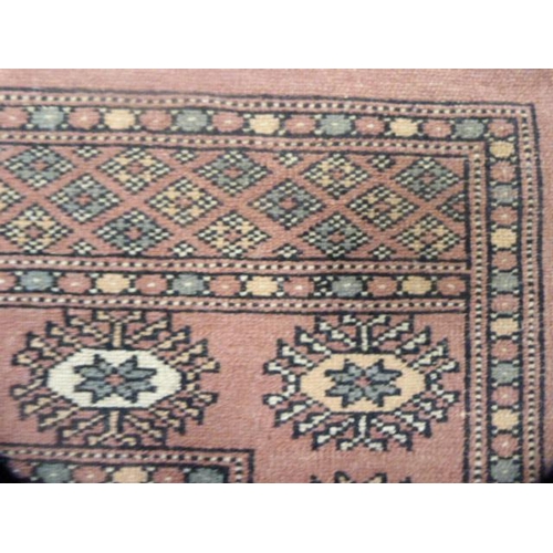 338 - Bokhara machine-made rug.