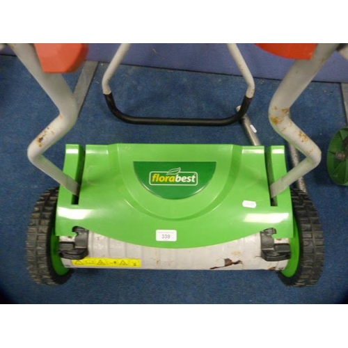 339 - Florabest lawnmower and a lawn aerator.  (2)