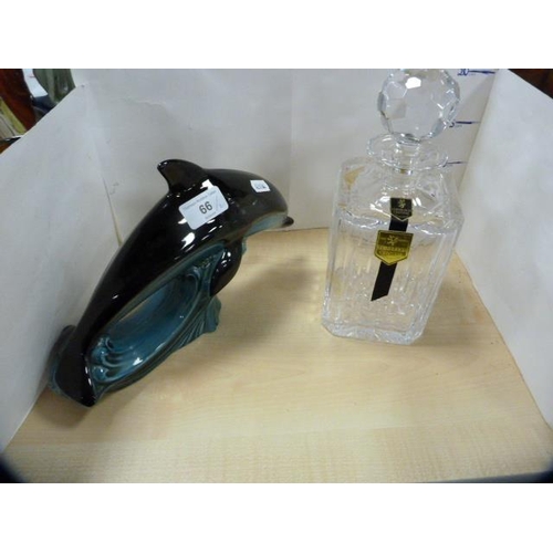 66 - Edinburgh Crystal decanter, boxed, and a Poole figure of a dolphin.