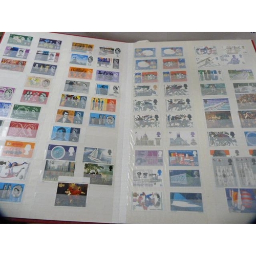 74 - Five albums containing assorted stamps.