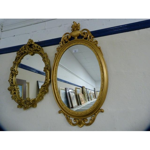 99 - Two reproduction wall mirrors, one in the Victorian style.