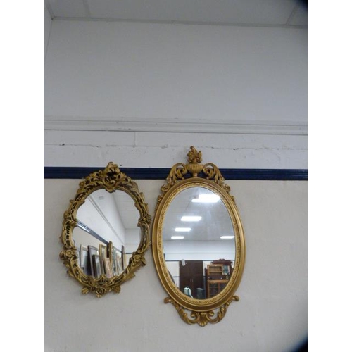 99 - Two reproduction wall mirrors, one in the Victorian style.