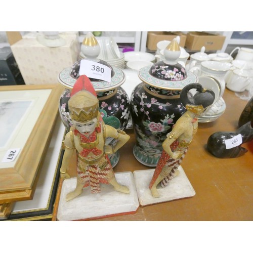 380 - Pair of 19th century Famille rose lidded urns. 22cm high and two figures.