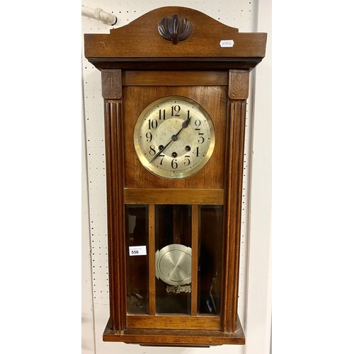 556 - Mahogany wall clock,