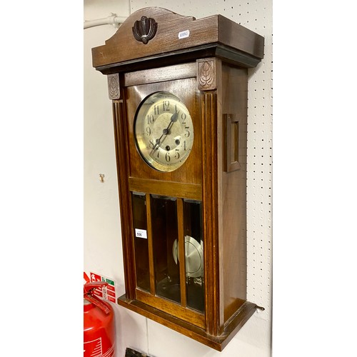 556 - Mahogany wall clock,