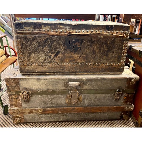 473 - Studded travel trunk, with animal skin outer, 61 x 32 x 29 cm high, with a larger travel trunk (2)