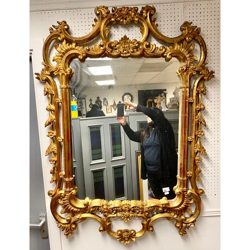 441 - Ornate carved giltwood mirror, 84cm x 62cm (excl. frame)