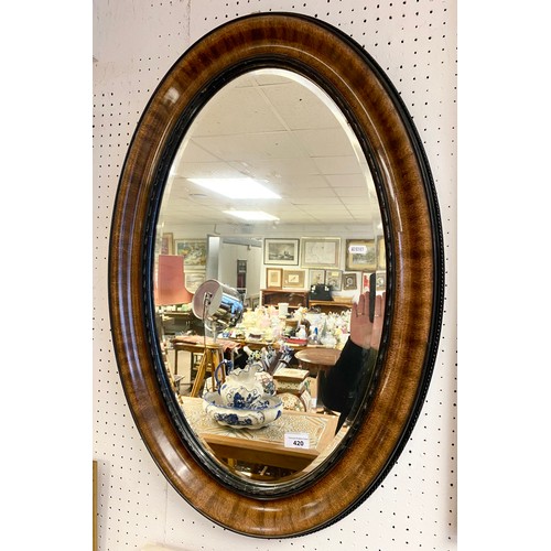 420 - Large Edwardian oval hardwood bevel edge mirror, 80x 54 cm