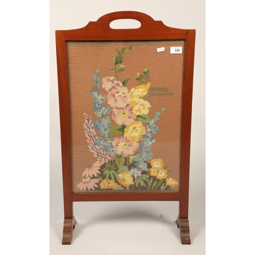 520 - Mahogany needlework glazed fire screen, 74 cm high