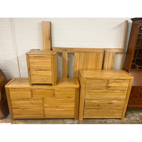 571 - Contemporary oak bedroom suite, comprising of two chests of drawers, two drawer bedside chest & ... 