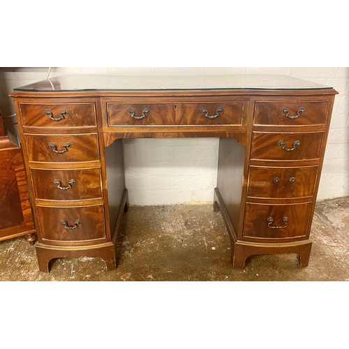 557 - Red leather topped mahogany pedestal desk with glass preserve,58cm x 77cm x 118cm