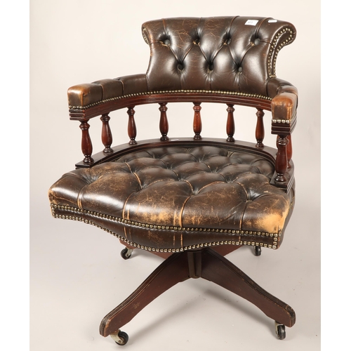 577 - Captain's swivel chair with brown leather upholstery