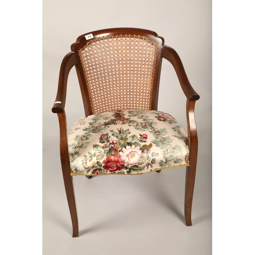 579 - Mahogany bergere open armchair, floral upholstery and stitched floral cover