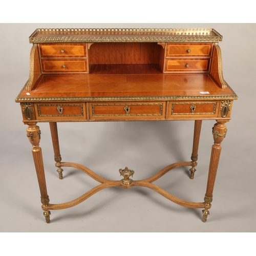 595 - Rococo-style desk with gilt balustrade and ornate gilt border and designs, H 96cm, W 94cm, D 43.5cm