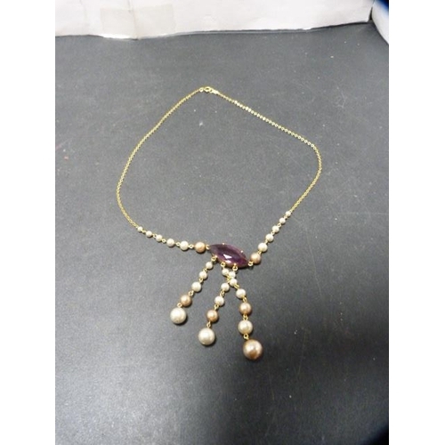 201 - Synthetic pearl and amethyst pendant on 9ct gold chain, 9g gross.