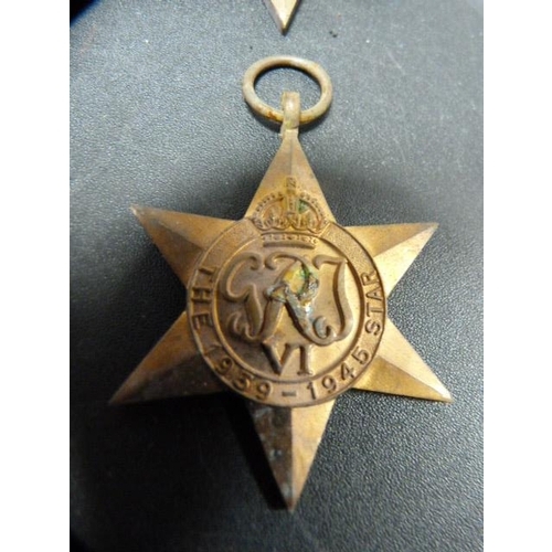 212 - WWII war and defence medal, Italy star and George VI star etc.