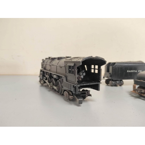 150 - Marx. 0 gauge electric die-cast 4-6-2 locomotive with New York Central and Santa Fe tenders. (3)... 