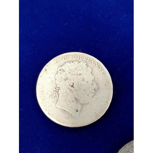 325 - United Kingdom. George IV 1821 silver crown, and another George III crown. (2)