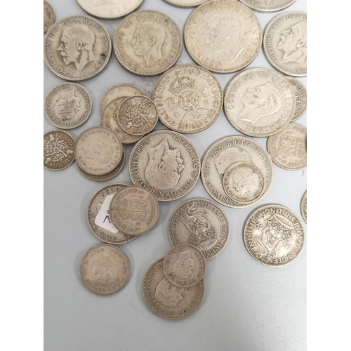 329 - United Kingdom. Large collection of .500 grade silver coins to include shillings, halfcrowns, sixpen... 