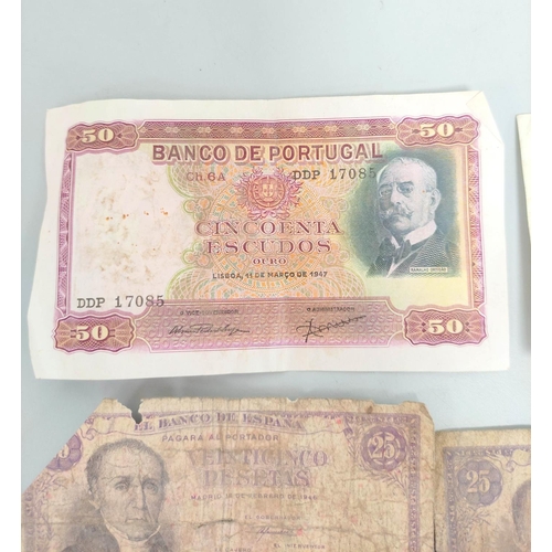 343 - Group of world banknotes to include a Portuguese 1947 50 escudos serial number DDP 17085, four Spani... 