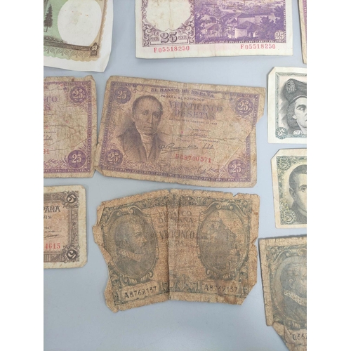 343 - Group of world banknotes to include a Portuguese 1947 50 escudos serial number DDP 17085, four Spani... 