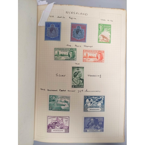 390 - Three postage stamp albums to include an album of mint stamp sheets with examples from Aden, New Zea... 