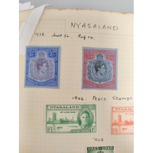 390 - Three postage stamp albums to include an album of mint stamp sheets with examples from Aden, New Zea... 