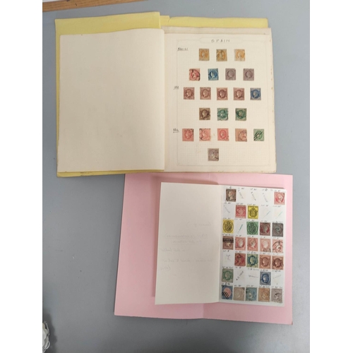 392 - Two folders of early Spanish postage stamps many 1850s imperforated and later issues. To include an ... 