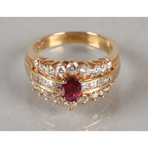 103 - Ladies 14 k gold Ruby and Diamond ring, Central ruby flanked by four square cut diamonds either side... 