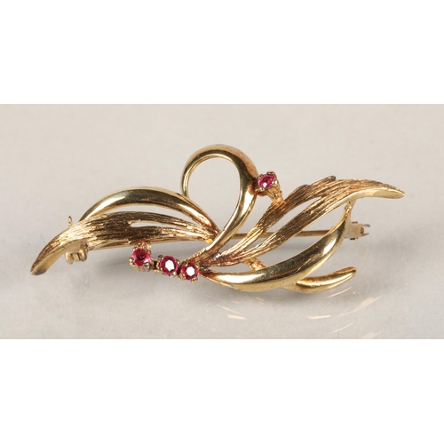 55 - 9 ct gold and ruby brooch, total weight 4 grams