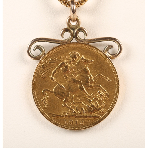 61 - Full Sovereign, dated 1912, on 9 ct  chain, with mount 12g