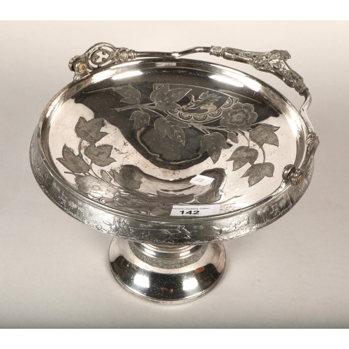 142 - Ornate silver plated cake basket with handle and raised base