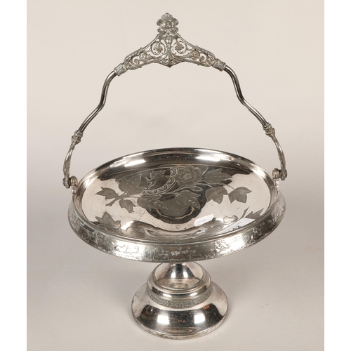 142 - Ornate silver plated cake basket with handle and raised base