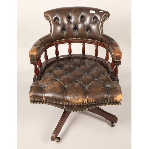 577 - Captain's swivel chair with brown leather upholstery