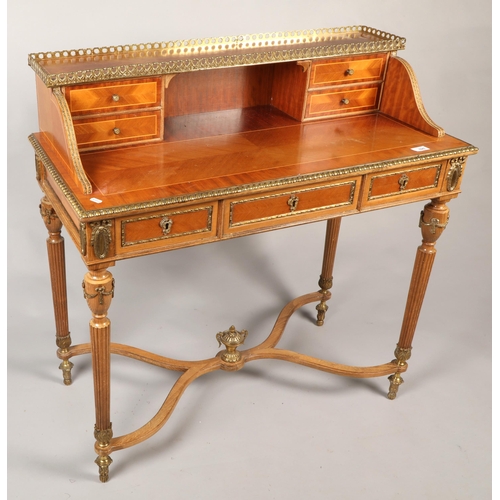 595 - Rococo-style desk with gilt balustrade and ornate gilt border and designs, H 96cm, W 94cm, D 43.5cm