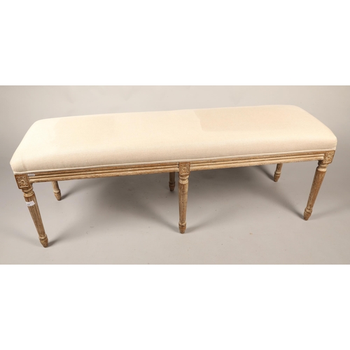 601 - Contemporary bench with cream upholstery, H 48cm, W 130cm, D 38cm