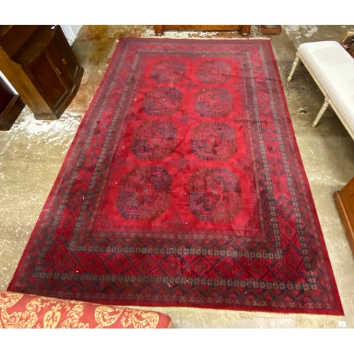 599 - Red Persian-style rug, 285cm x 200cm