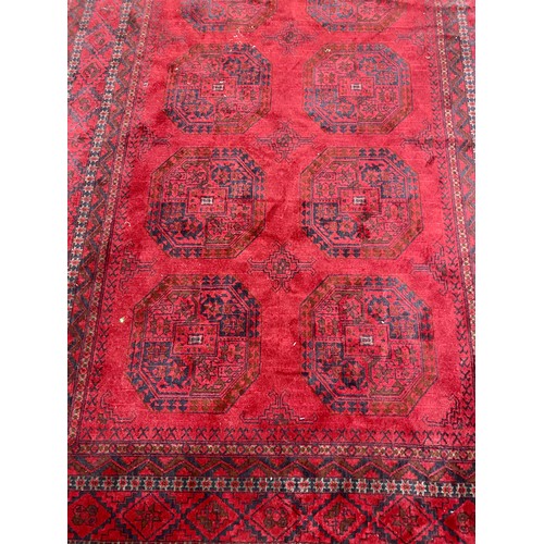 599 - Red Persian-style rug, 285cm x 200cm