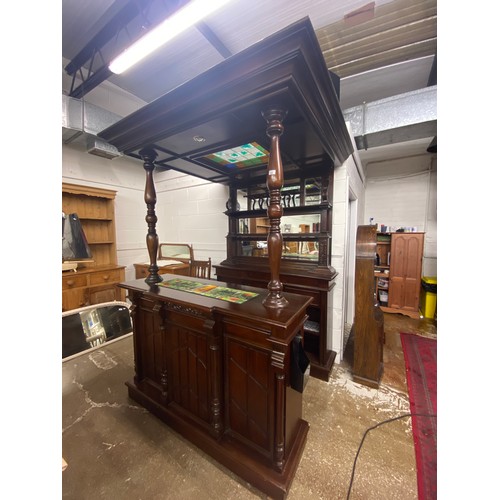 628 - Mahogany Bar, with colour glass canopy, glass back display with three drawers over shelving, the bar... 