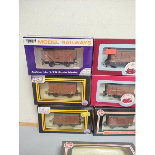 189 - Dapol. Twelve boxed 00 gauge rolling stock carriages and covered wagons to include two 12 Ton Vent V... 