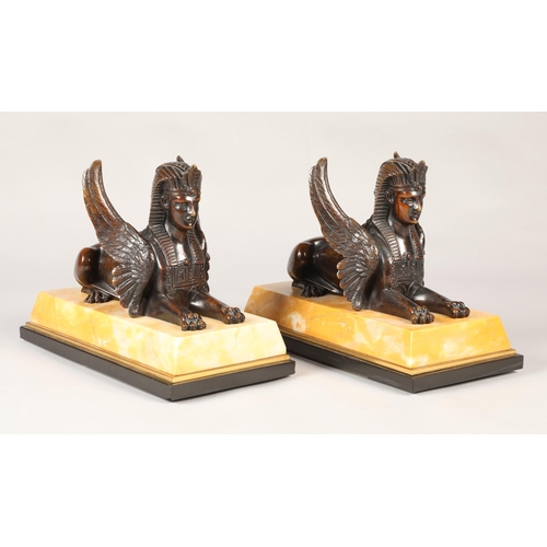 252 - Pair of bronze Egyptian revival winged Sphinx on marble base, overall length 28 cm  (2)